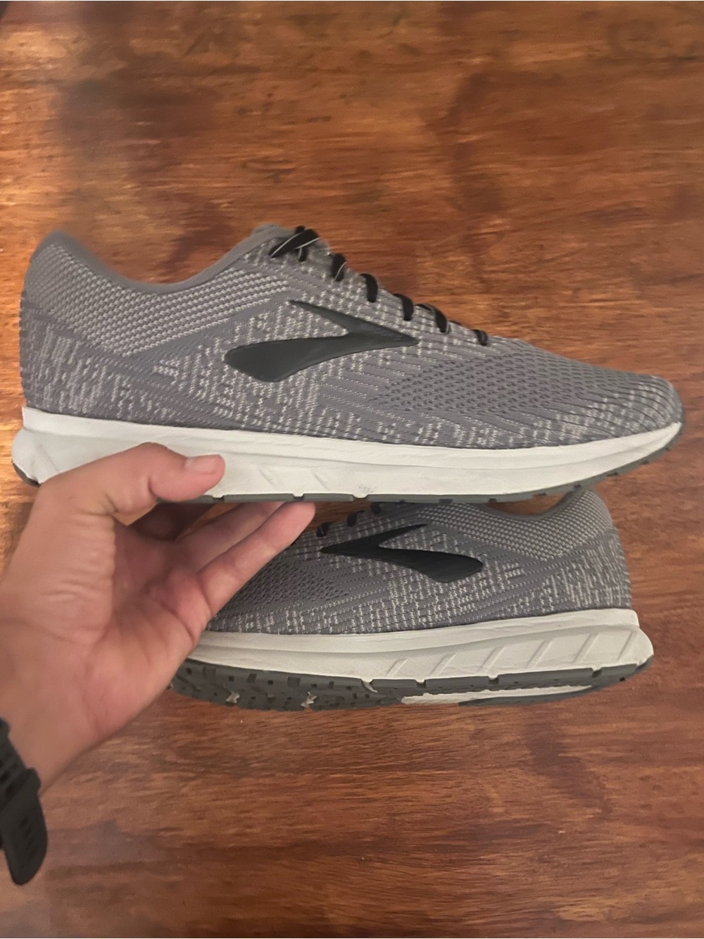 Brooks Revel 3 running shoes in a grey flat-knit upper with a prominent Size 13
